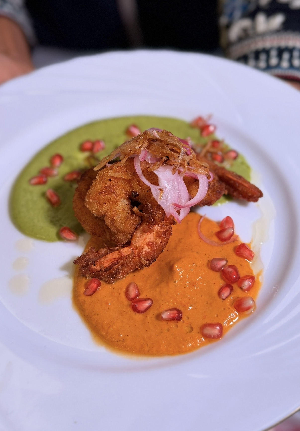 Prawns with green and orange sauces, pickled onion and pomegranate at the Bangladesh pop-up