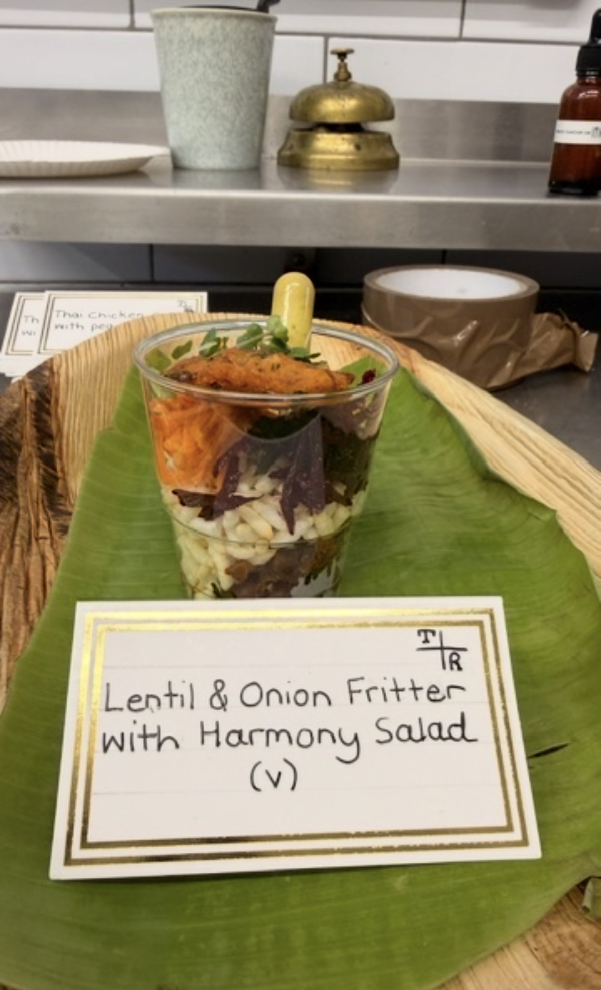Lentil and onion fritter with harmony salad, served in a cup