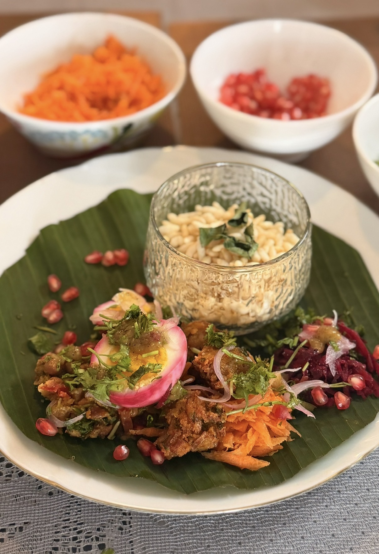 Colourful salad with puffed rice, pickled egg and pomegranate on a banana leaf at the Bangladesh pop-up