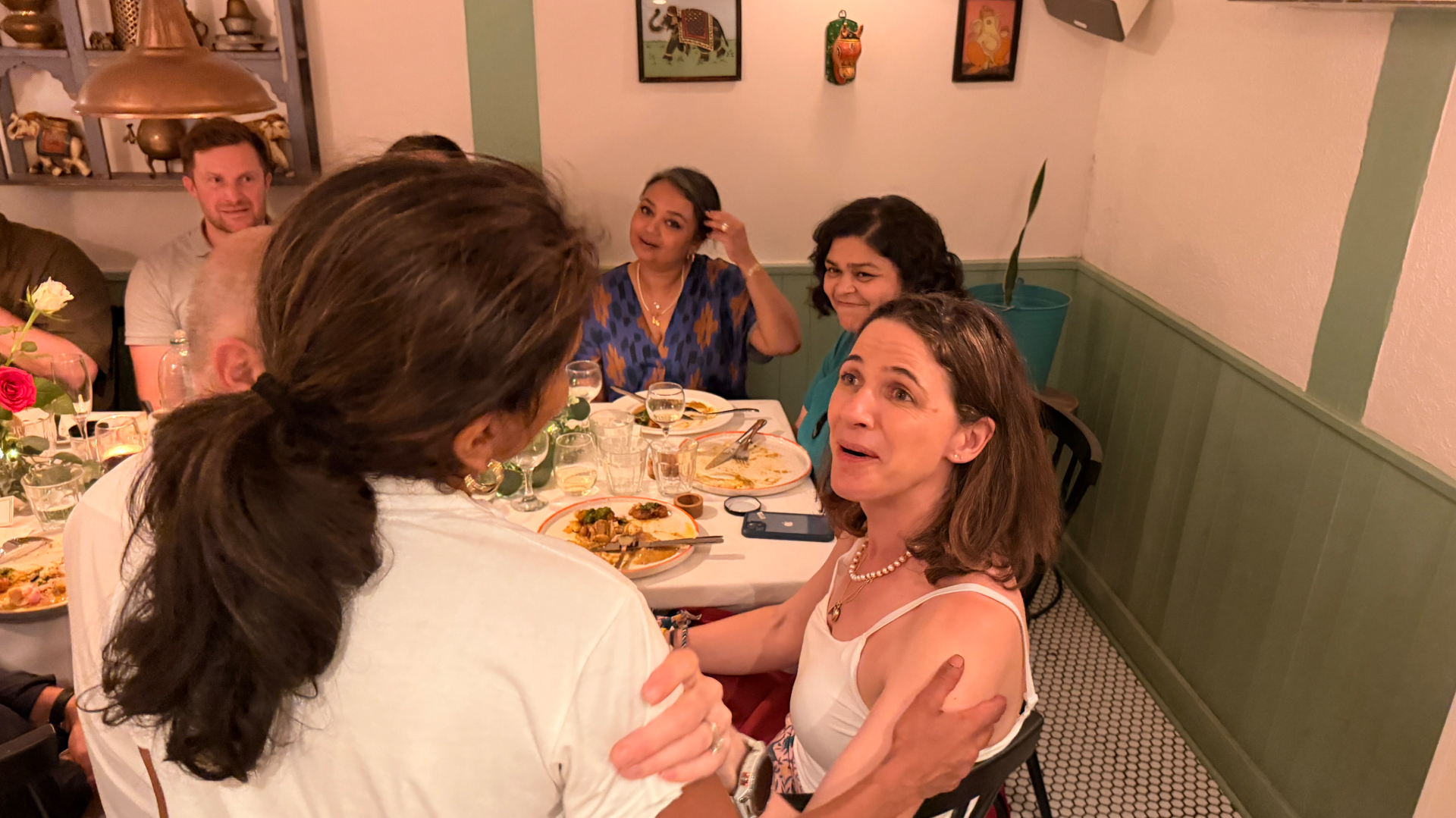 Sabina chatting with a guest during supper-club dinner