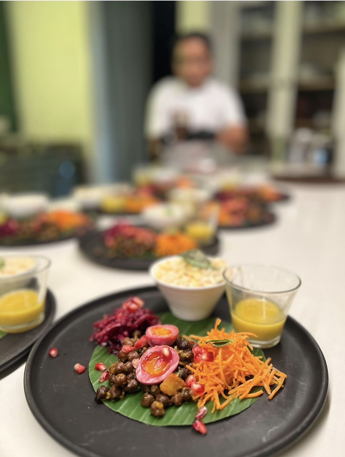 Colourful salad plates with rice and dressing, ready for service